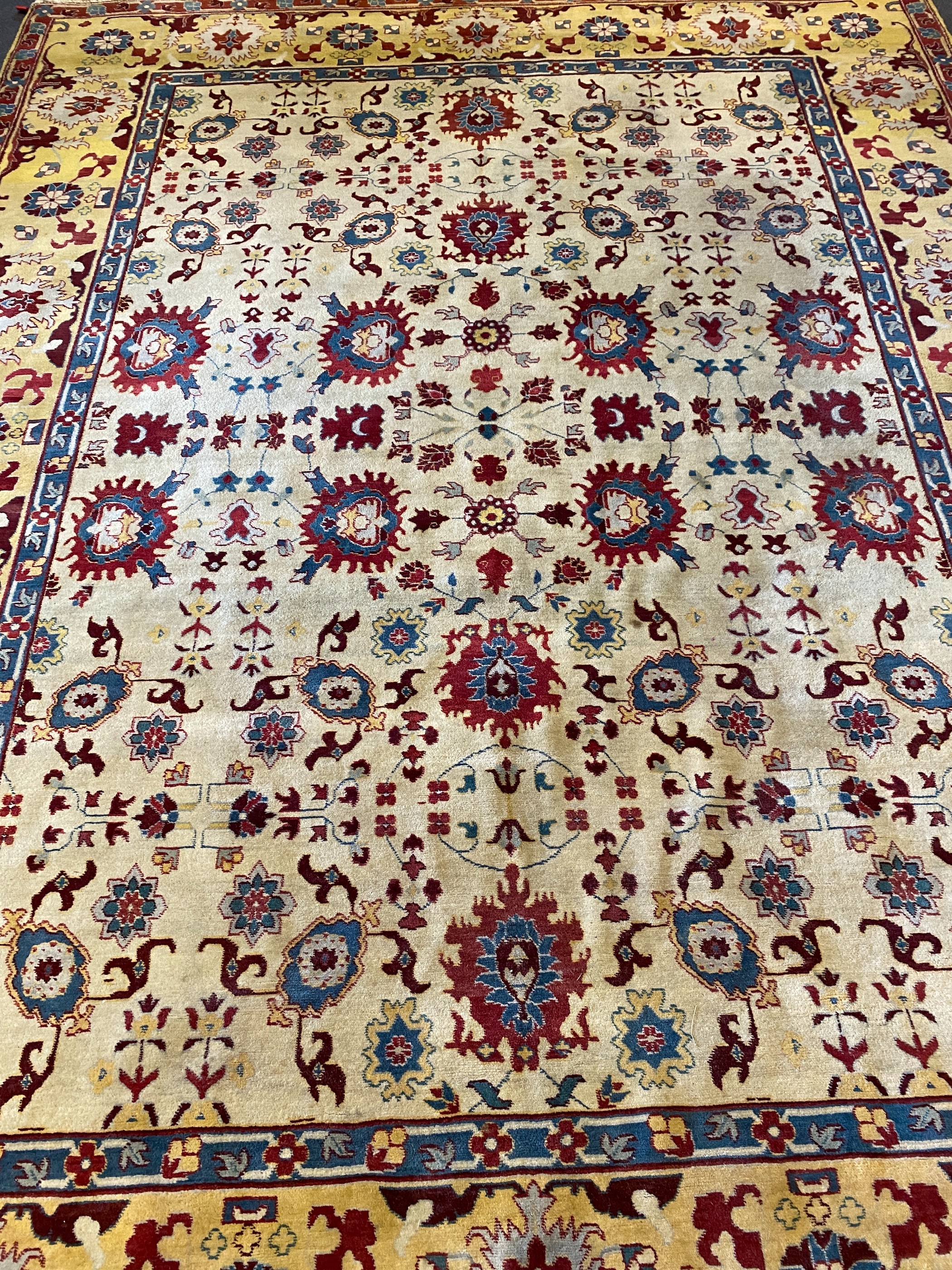 An Agra ivory ground carpet, 360 x 274cm